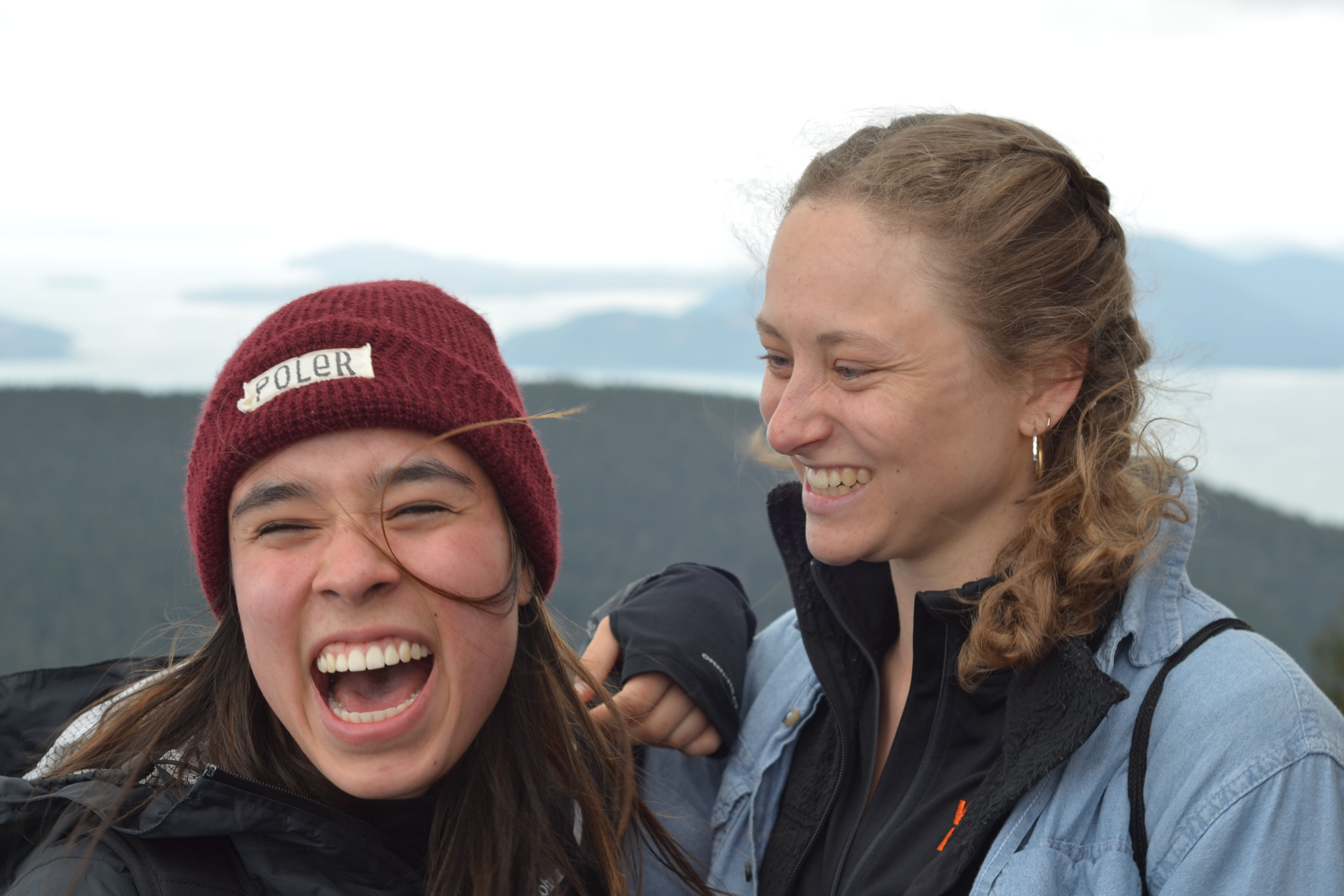 Two students sharing a laugh on Outdoor Retreat.