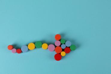 Arrow made up of colored dots