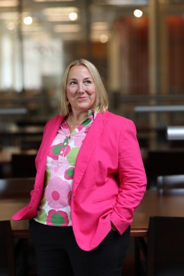 Dean Monica J. Casper in the library