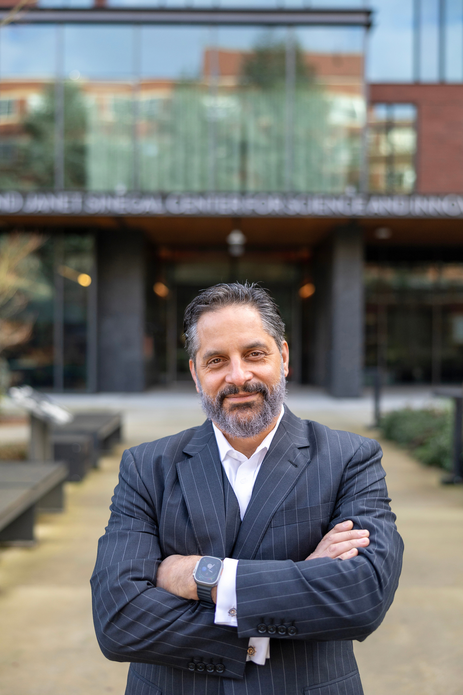 President Peñalver standing in front of the Sinegal building