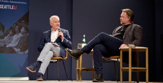 Two speakers on stage for Conversations