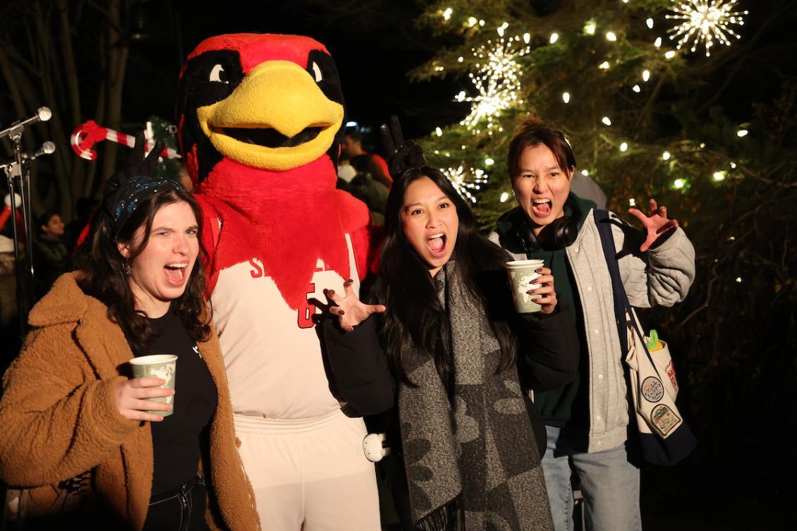 Christmas tree lighting students with Rudy