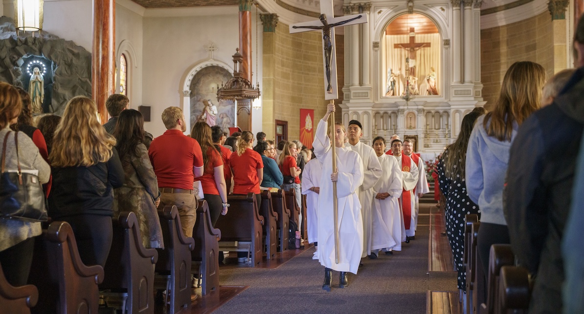 Procession in white at Mass