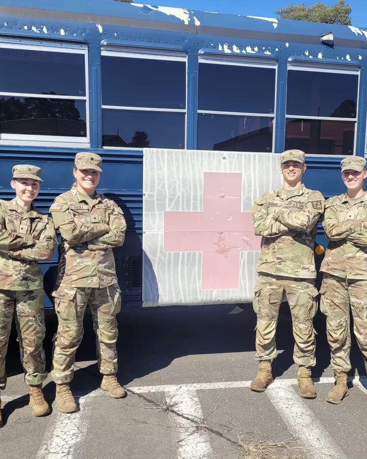 Nurse cadets in front of Red Cross bus